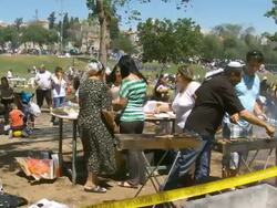 MS Shot of local people having picnik and barbecue grill on independence day celebration at Sacker park / Jerusalem, Judea, Israel Stock Footage