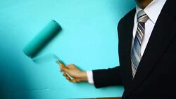 businessman hand hold Paint Roller Stock Footage