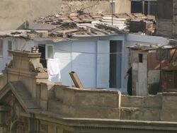 WS View of women entering in room on rooftop of apartment building, interior view of family life in small apartment / Cairo, Egypt Stock Footage