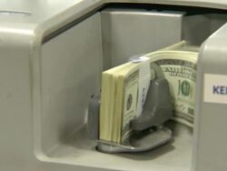 Bill counting machine counting one hundred dollar bills in Korea Exchange Bank Stock Footage