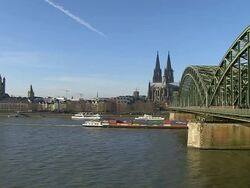WS View of Rhine river with Hohenzollern Bridge and Dom (Cathedral) / Cologne, North Rhine Westphalia, Germany Stock Footage