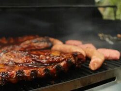 Grill and Meat being cooked Stock Footage