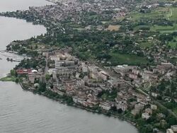 WS AERIAL View of town Montreux near coast / Vaud, Switzerland Stock Footage