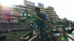 Sadarghat Launch Terminal in Dhaka Bangladesh is a bustling passenger transport hub where tiny wooden boat taxis paddle alongside huge steel ferries Stock Footage