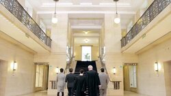 Judges and lawyers walking in courthouse Stock Footage