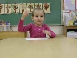 MS Young girl working on writing inside classroom at school / Minneapolis, Minnesota, United States Stock Footage