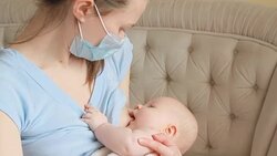 Sick mother breastfeeding her baby Stock Footage