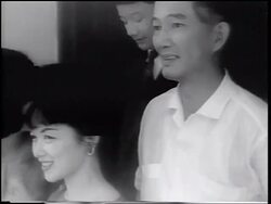 B/W 1963 close up Ngo Dinh Nhu (head of secret police) + Madame Nhu standing outdoors / Vietnam Stock Footage