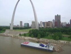 AERIAL WS TS Helicopter moving near Gateway Arch and landing on boat / St Louis, Missouri, United States  Stock Footage