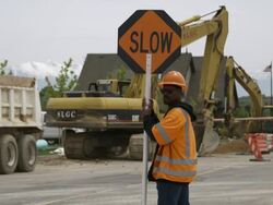 Static shot of a man holding a stop sign. Stock Footage