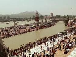 Pilgrims at riverbank, Ganges River, Haridwar, Uttarakhand, India Stock Footage