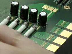 Technician soldering circuit board in manufacturing plant Stock Footage