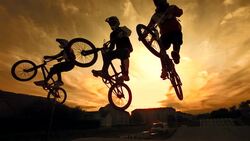 HD Super Slow-Mo: Silhouette Of Stunt Bmx Riders Stock Footage