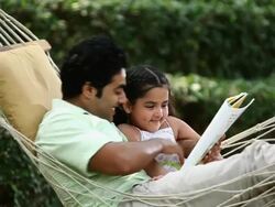 Man telling story to his daughter  Stock Footage