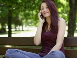 Young girl talking on the phone Stock Footage