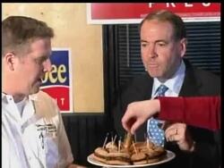 In Concord, New Hampshire, Republican presidential candidate Mike Huckabee taste tests the "Huckaburger." News Clip