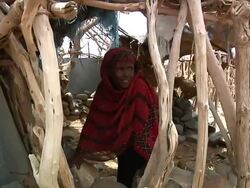 Afar woman under shelter made of wood Stock Footage