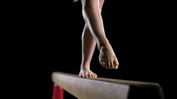 SLO MO Gymnast's legs while performing back walkover Stock Footage