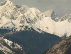 Bird glides over Rocky Mountains Stock Footage