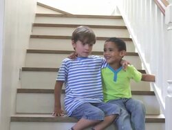 Two Young Boys Playing On Stairs At Home Stock Footage