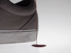 Art Abstract Backgrounds grey shoe with red blood drops Stock Footage