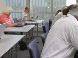 HD DOLLY: Seniors Practice Using Computer Stock Footage