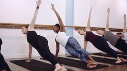 Women doing a plank workout in a studio Stock Footage