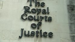 Tilt Down The Royal Courts of Justice Sign News Clip