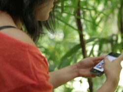Asian woman using smartphone searching website Stock Footage