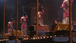 Diwali participants ring bells as diyas flicker. Stock Footage