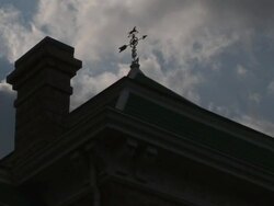 WS View of old wind vane on Texas courthouse beneath stormy sky / Texas, United States Stock Footage