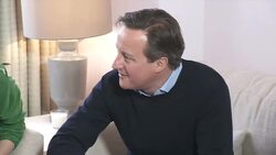 Samantha and David Cameron meeting young family News Clip