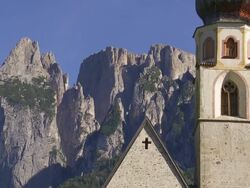Old Church in Front of Alpine Mountain TILT UP Stock Footage
