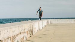 Practicing parkour next to the sea Stock Footage