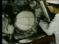 close up of John Glenn getting into Mercury capsule Stock Footage