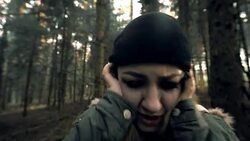 Woman fainting after having panic attack in the forest Stock Footage