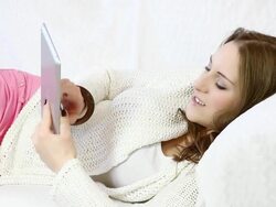 Relaxing with digital tablet at home. Stock Footage