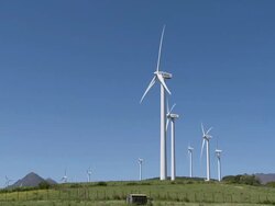 Wind farm, mountain in background, Spain Stock Footage