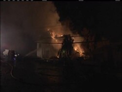 At least one person is dead and firefighters are still searching for victims of a massive fire in a San Francisco suburb that destroyed 53 homes and damaged 120 more. The cause is believed to be a ruptured natural gas line. News Clip