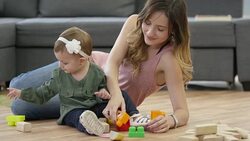 Mother and Baby Girl Playing with Toy Blocks Stock Footage
