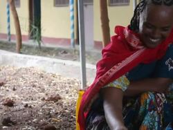 Ethiopian woman making popcorn for coffee ceremony Stock Footage