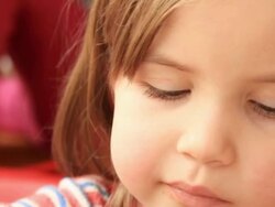 Little girl eating French fries at the fastfood Stock Footage