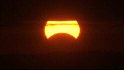 A rare partial solar eclipse swept across the East Coast of the U.S. early Sunday morning.  The moon cast a shadow over a portion of the sun as it was rising.  (Nov. 3) Instructional Video
