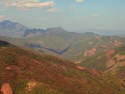 WS Shot of brownish green valleys / Bus trip from Vang Vieng to Luang Prabang, Vientiane, Laos Stock Footage