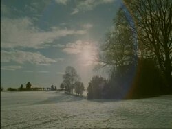 WA cotswold countryside in snow, sun and lens flare, Cotswolds, England Stock Footage