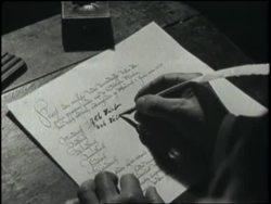 A man writes on handmade paper with a quill. News Clip