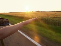 Woman with hand in breeze Stock Footage