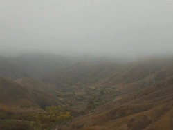 WS View of atlas mountain valley with foggy skies / Marrakech, Tensift, Morocco  Stock Footage