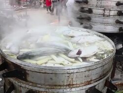 SWITH PAN Steamed fish in outdoor kitchen of a Wedding/xian,shaanxi,China Stock Footage