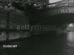 1966: BERLIN, GERMANY: TU Under arch of Weidendammer Bridge on Spree River, Angled WS (POV Boat) moving along river, VS Stone walls embankment w/ bullet holes, TD River water w/ boat moving slowly. [Possibly Bormann escape route May 1945] Instructional Video